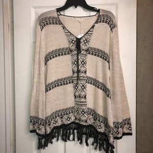 En Creme tan and black sweater